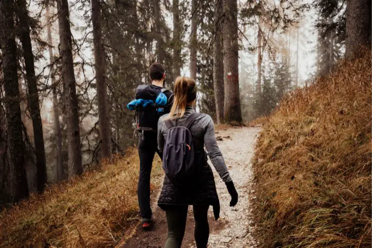 two people are hiking in cold weather