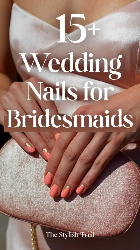 Close-up of a bridesmaid's hands with coral pink wedding nails featuring gold leaf accents, holding a blush pink textured clutch