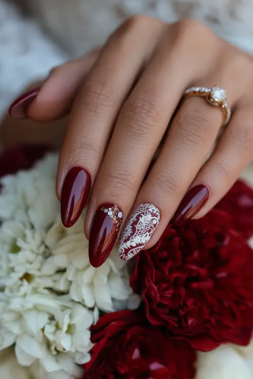 almond red nails of a bride with lace detail