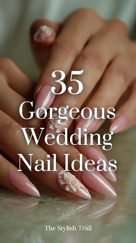 close up hands with long, glossy pink nails and 3D floral designs