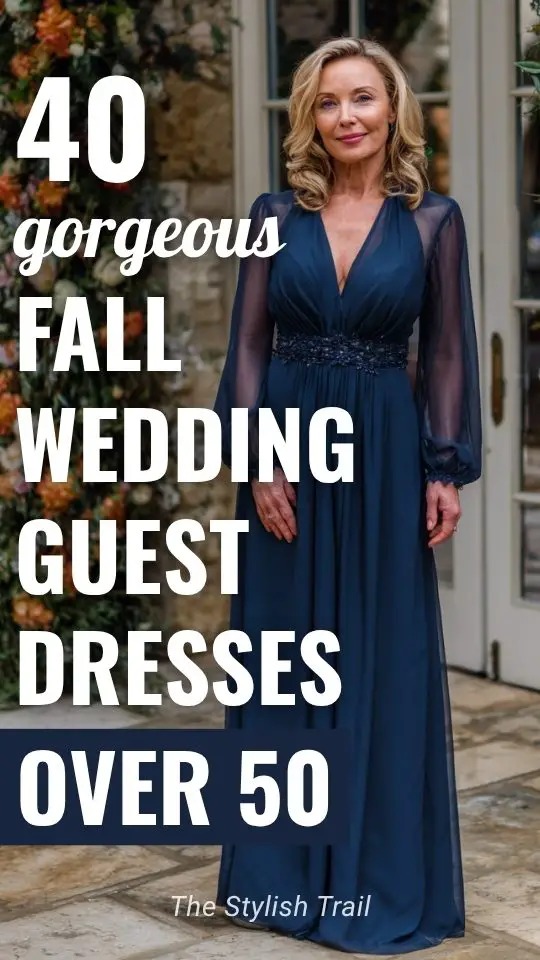 a woman over 50 wears a navy wedding guest dress with sheer sleeves for fall wedding