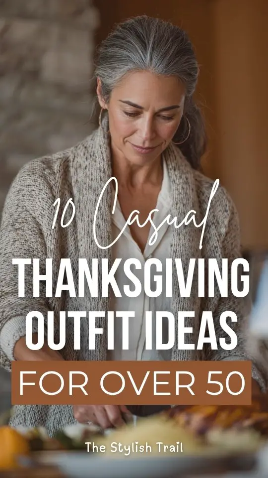 A woman over 50 wears a casual Thanksgiving outfit with a soft taupe cardigan layered over a white blouse, paired with dark trousers and loafers