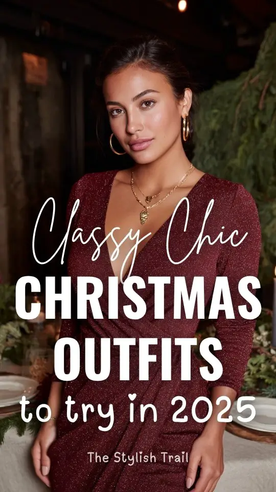 A woman wearing a classy chic Christmas outfit with a burgundy wrap dress with subtle shimmer and gold jewelry