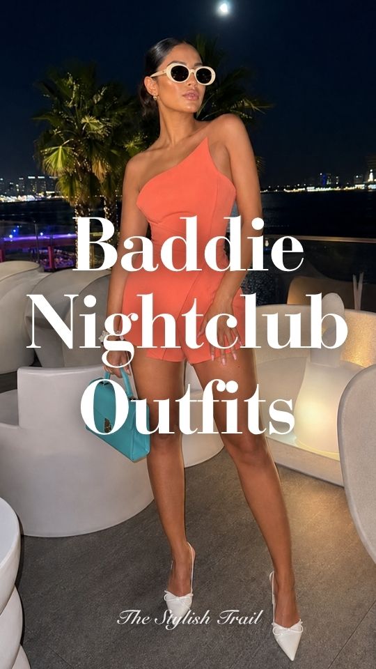 A woman wears a baddie nightclub outfit with a coral one-shoulder mini dress, sunglasses, and white heels
