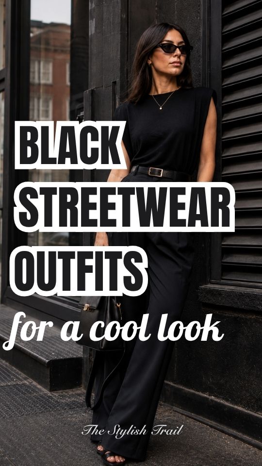 A woman wears a black streetwear outfit with a balck sleeveless top and black high-waisted wide-leg trousers