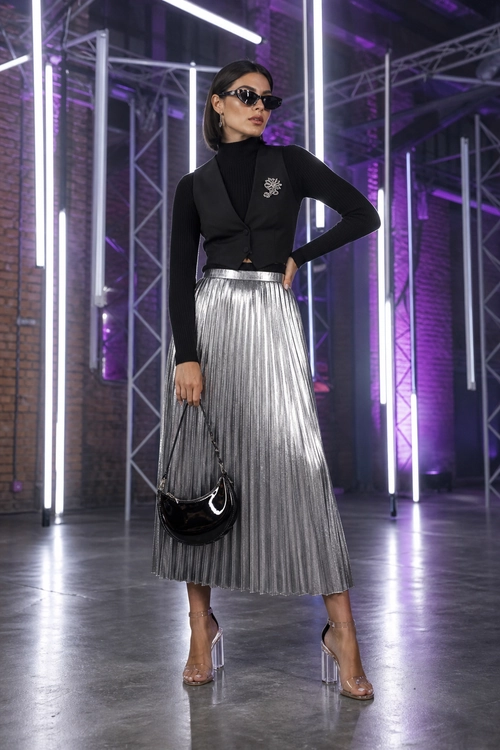 Black and Silver Pleated Skirt Outfit A black high-neck outfit with a cropped vest, silver pleated midi skirt, black shoulder bag, sunglasses, and transparent heeled sandals.