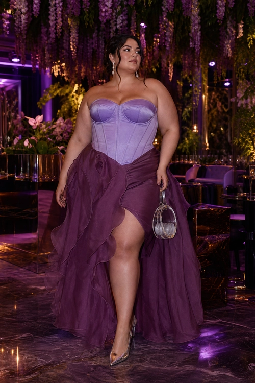 Lavender Corset and Plum Ruffle Skirt A lavender strapless corset top styled with a plum ruffled high-low skirt, pointed-toe pumps, and a small silver handbag.