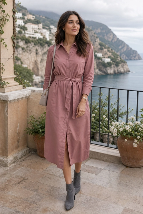 Mauve Belted Shirt Dress Outfit Woman wearing a mauve long-sleeve belted shirt dress with gray ankle boots and a taupe shoulder bag.
