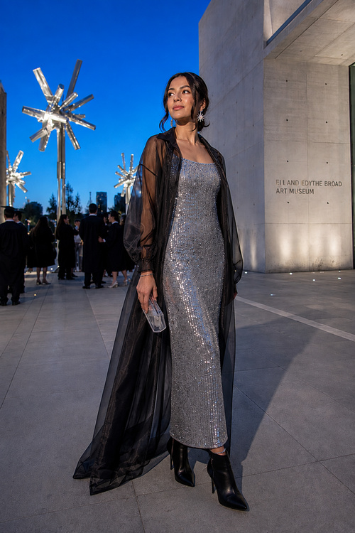 Woman in a silver sequin dress at an evening event