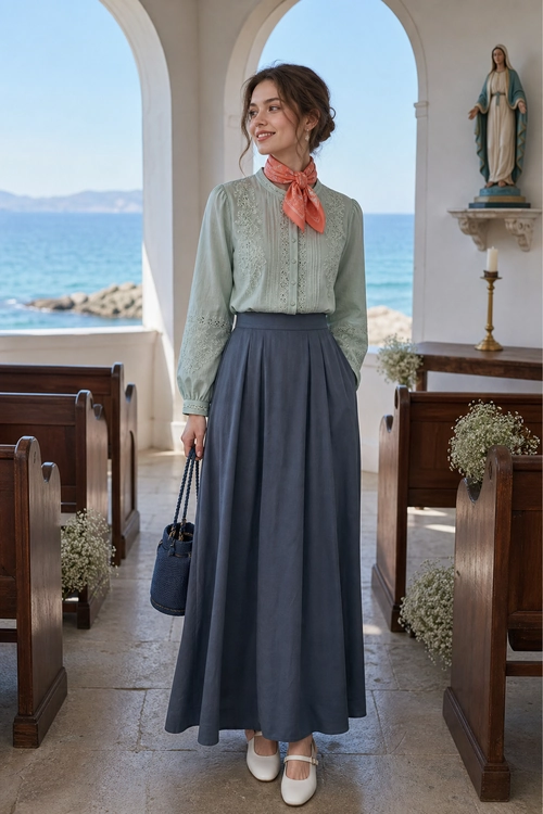 Sage Blouse and Full Midi Skirt Outfit A sage green embroidered blouse with a coral neck scarf, full slate gray midi skirt, white Mary Jane flats, and a navy woven handbag.