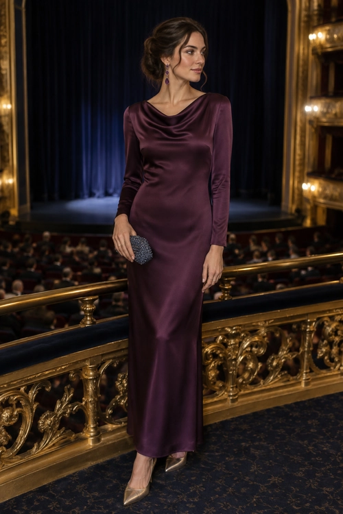 Woman wearing a long plum satin dress with a draped neckline, dangling earrings, a beaded clutch, and pointed metallic heels.